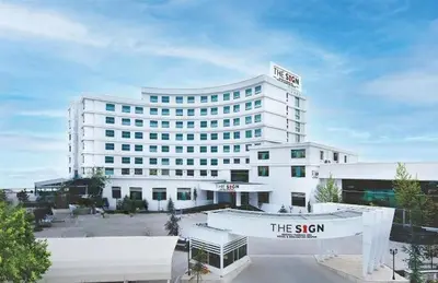 a white building with a sign in front of it at The Sign Kocaeli Thermal Spa Hotel &Convention Center in Yeniköy
