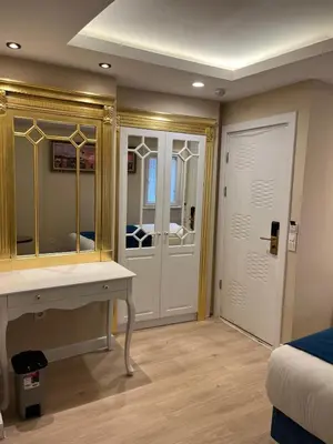 a room with a dressing table and a mirror at Hotel Barbarosa in Istanbul