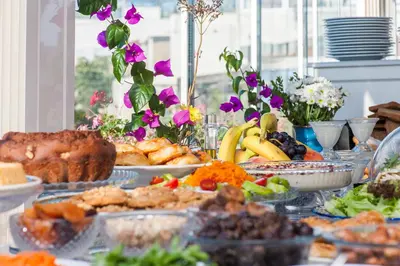 a table topped with lots of food on top at Darussaade Hotel Old City - Sultanahmet in Istanbul