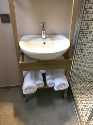 a bathroom with a sink and towels at Jurnal Hotel in Istanbul