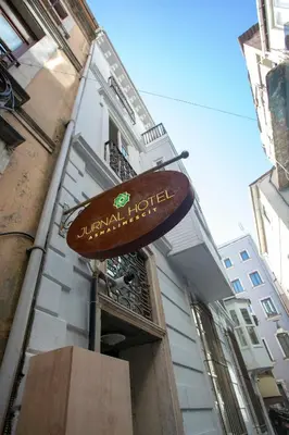 a sign for a hotel on the side of a building at Jurnal Hotel in Istanbul