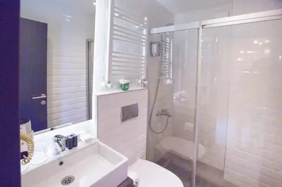 a bathroom with a shower and a toilet and a sink at Cityloft 36 in Istanbul