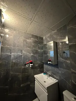 a bathroom with a sink and a toilet and a mirror at Modena Hotel in Istanbul