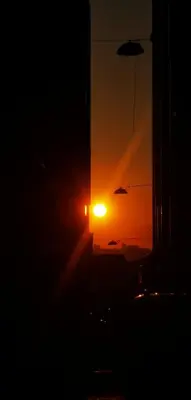 a sunset with the sun setting in the distance at taksim diamond hotel in Istanbul