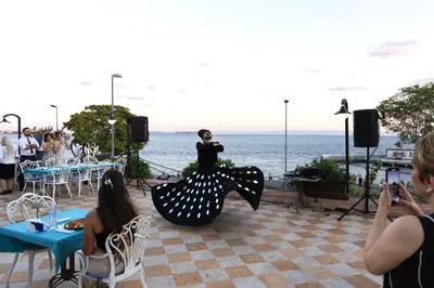 a woman in a polka dot dress standing on a stage at Seven Hills Palace & Spa in Istanbul