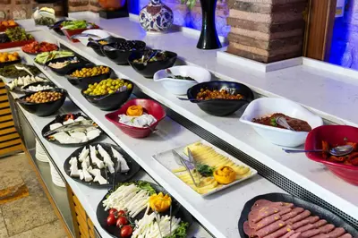 a buffet line with many different types of food at Seven Hills Palace & Spa in Istanbul
