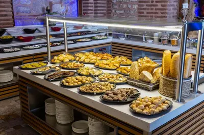 a buffet line with many different types of food at Seven Hills Palace & Spa in Istanbul