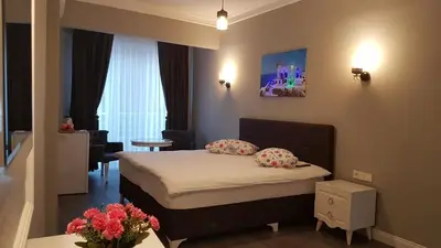 a bedroom with a bed with two pillows on it at Little Palace Blue Apartment in Istanbul