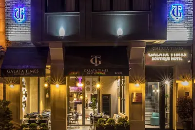 a restaurant exterior at night with lights at Galata Times Hotel in Istanbul