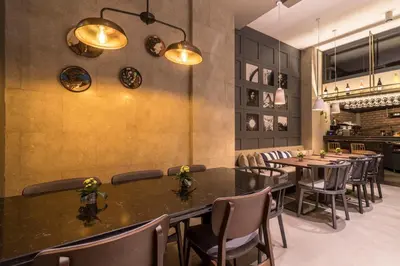 a restaurant with a long table and chairs at Galata Times Hotel in Istanbul