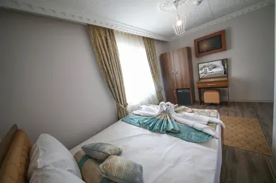 a hotel room with a bed with towels on it at DELBAB HOTEL in Istanbul