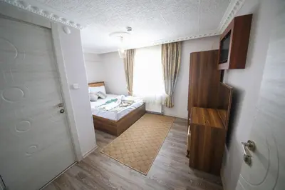 a small room with a bed and a window at DELBAB HOTEL in Istanbul