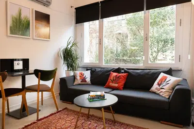 a living room with a couch and a table at Mayer Tatarbey Apartments in Istanbul