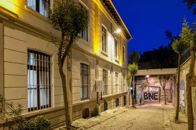 an empty street at night with a building at Element Garden in Istanbul