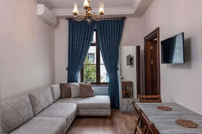 a living room with a couch and a window at Element Garden in Istanbul
