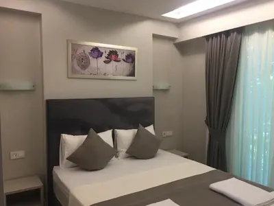 a bedroom with a bed and a window and a bed sidx sidx sidx at KONAK BELLA 3 in Istanbul