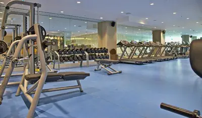 a gym with rows of treadmills and machines at Rotta Hotel Istanbul in Istanbul