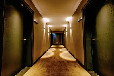 an empty hallway with a long corridor at Osmanbey Fatih Hotel in Istanbul