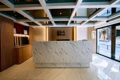 a lobby with a marble counter in a building at Osmanbey Fatih Hotel in Istanbul