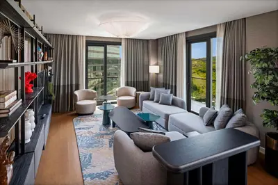 a living room with couches and a couch and a table at Radisson Residences Vadistanbul in Istanbul