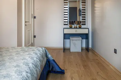 a bedroom with a bed and a sink in a room at Norah Suites Hotel İstanbul in Istanbul