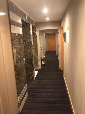 a hallway with a long corridor with a long corridorngth at Maywood Hotel in Istanbul