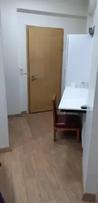 an empty room with a desk and a door at Arya Hotel in Istanbul