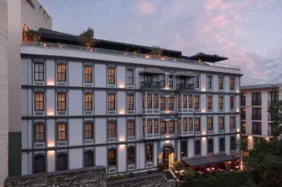 a large white building with lights on it at DeCamondo Galata, a Tribute Portfolio Hotel in Istanbul