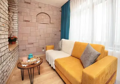 a living room with a couch and a table at Ardilas Residence in Istanbul