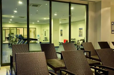 a room with chairs and a gym with a treadmill at CTS Elysium Residence Duplex Apt. 85 in Istanbul