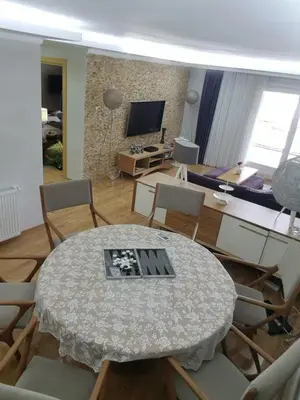a living room with a table and chairs at Boğazın incisi.. in Istanbul