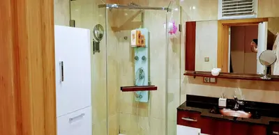 a bathroom with a shower with a sink and a mirror at Boğazın incisi.. in Istanbul