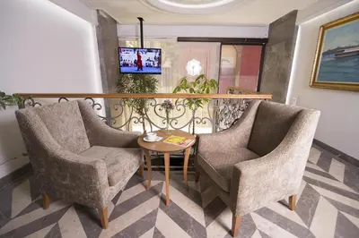two chairs and a table in a room at Cumbali Suite Hotel in Istanbul