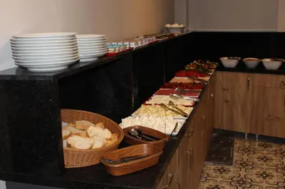 a buffet line with plates and bowls of food at The Lola Hotel in Istanbul