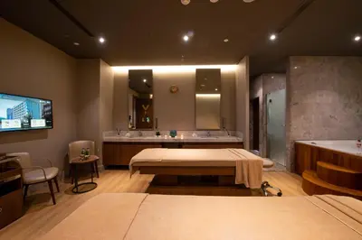 a bathroom with a bed and a sink and a tub at The Craton Hotel Sisli in Istanbul
