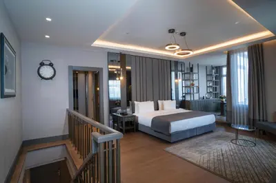 a hotel room with a bed and a staircase at Arts Hotel Taksim in Istanbul