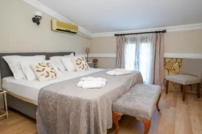 a bedroom with two beds with towels on them at Ağva Acquaverde Otel in Agva