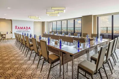 a large conference room with a long table and chairs at Ramada Plaza By Wyndham Istanbul Tekstilkent in Istanbul