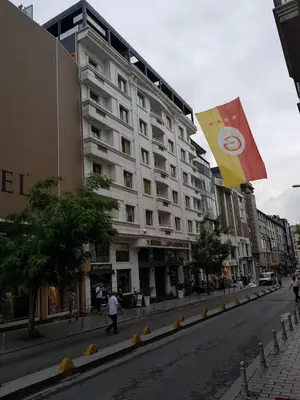 a building on a city street with a kite in the air at Grand Washington Hotel in Istanbul