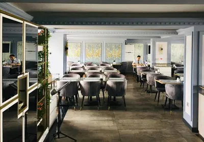 a restaurant with tables and chairs in a room at Grand Washington Hotel in Istanbul