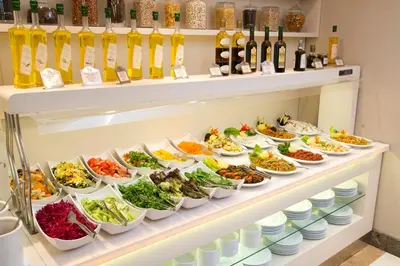 a display case filled with lots of food at Nidya Hotel Galataport in Istanbul