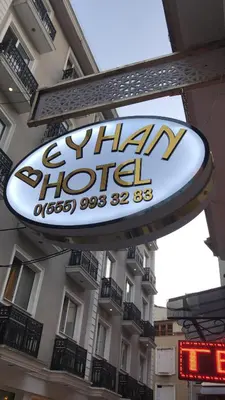 a sign for a restaurant in front of a building at Beyhan Hotel in Istanbul