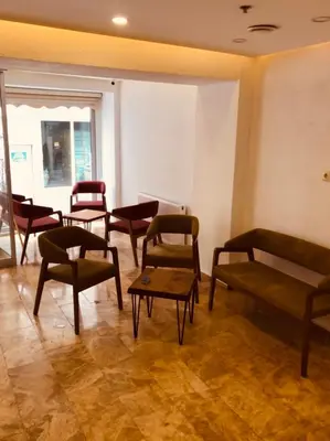 a waiting room with chairs and a table at Beyhan Hotel in Istanbul