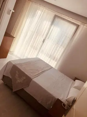 a bed in a room with a large window at Beyhan Hotel in Istanbul