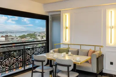 a dining room with a table and chairs and a large window at Rast Hotel Sultanahmet in Istanbul