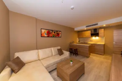 a living room with a couch and a kitchen at 38 Hotel in Istanbul