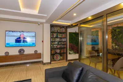 a living room with a couch and a flat screen tv at 38 Hotel in Istanbul