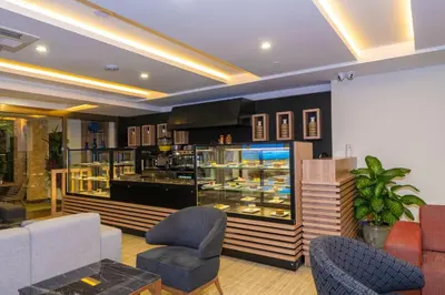 a living room with a counter and chairs and a counter at 38 Hotel in Istanbul