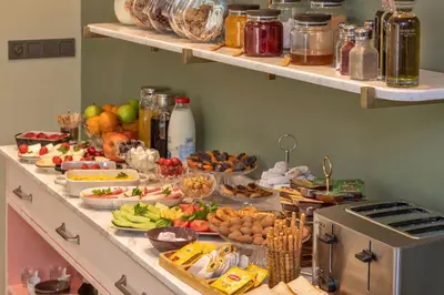 a buffet with many different types of food on it at Nika otel & cafe in Istanbul