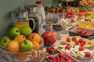 a table with a bunch of fruits and other food at Nika otel & cafe in Istanbul